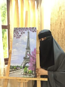 YumnaArtify with her Hand made painting.